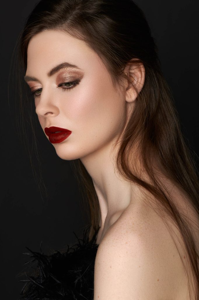 Beauty close-up with smoky eye makeup and a deep red lip